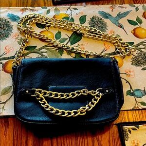 Black Faux leather chain bag with magnetic closure and inside zip pocket